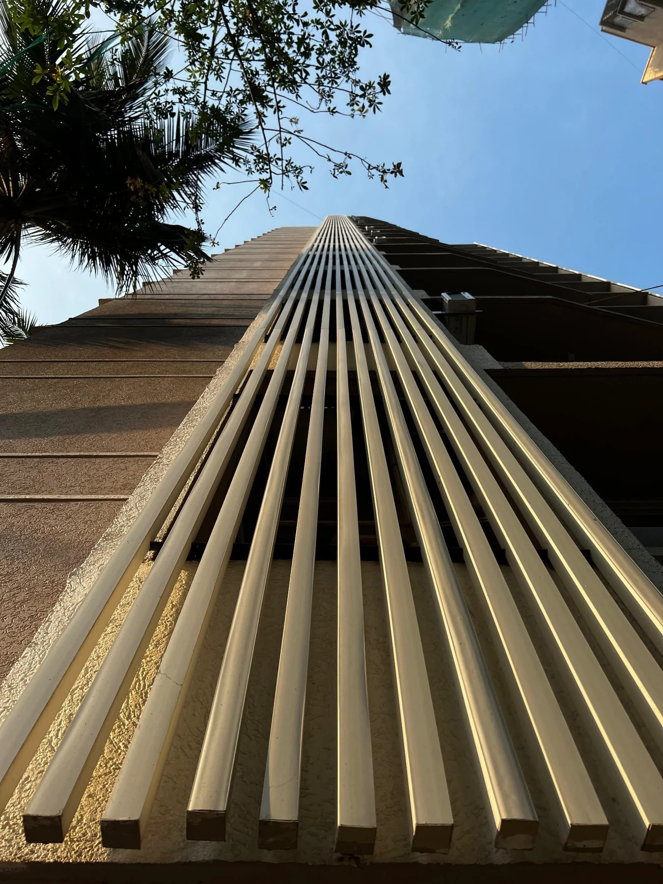 Vertical UPVC fins running the full height of a building facade