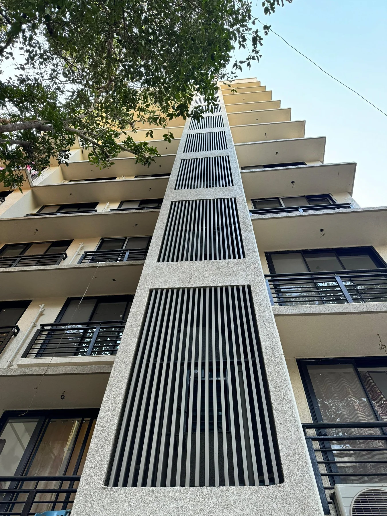 Commercial residential tower facade with UPVC fin accents